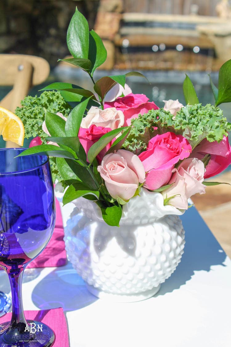 A bright and fresh spring table setting idea perfect for Easter, Mother's Day or a pool party! See more on https://ablissfulnest.com/ #tablesetting #tablescape #springtabledecor