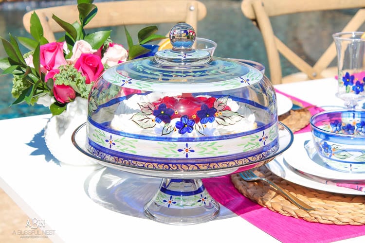 A bright and fresh spring table setting idea perfect for Easter, Mother's Day or a pool party! See more on https://ablissfulnest.com/ #tablesetting #tablescape #springtabledecor