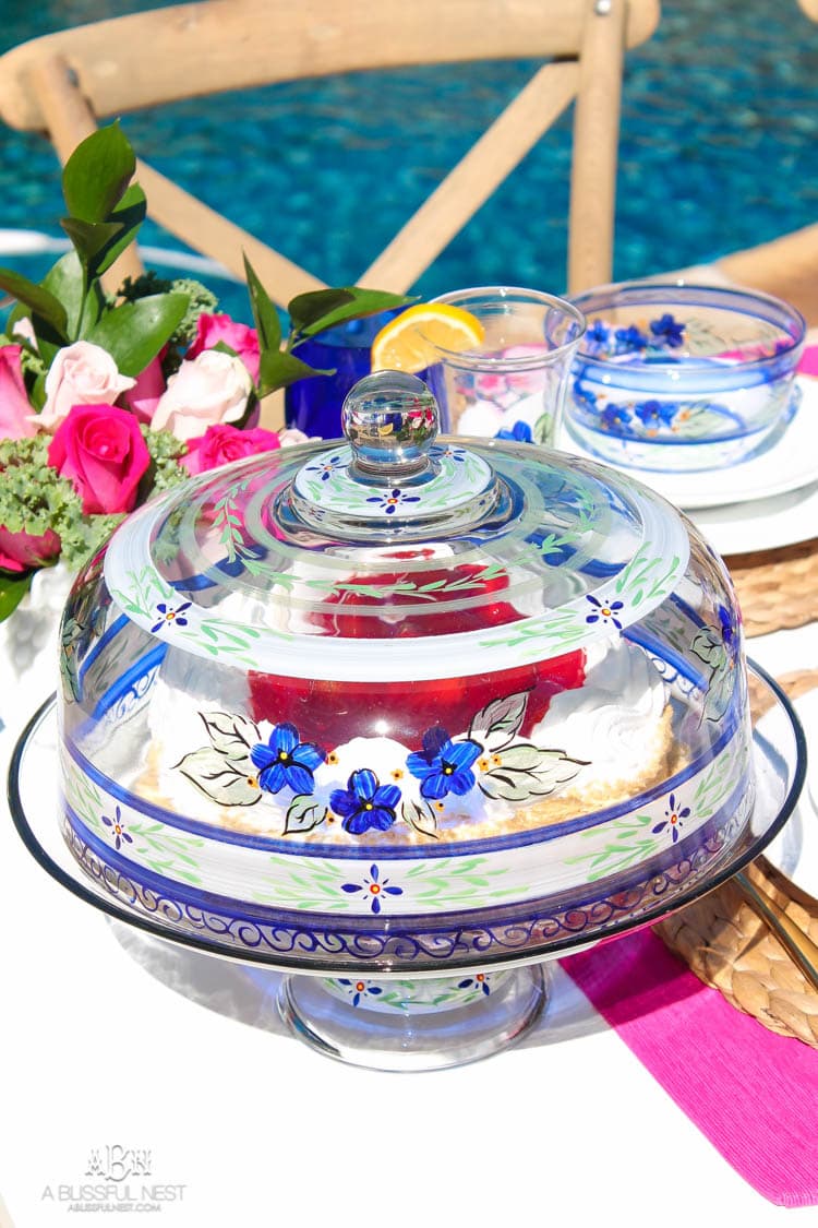 A bright and fresh spring table setting idea perfect for Easter, Mother's Day or a pool party! See more on https://ablissfulnest.com/ #tablesetting #tablescape #springtabledecor