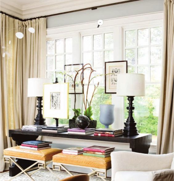 Easy ways to style a console table by adding height, seating, and accessories. for more ideas go to www.ablissfulnest.com #interiors #tips