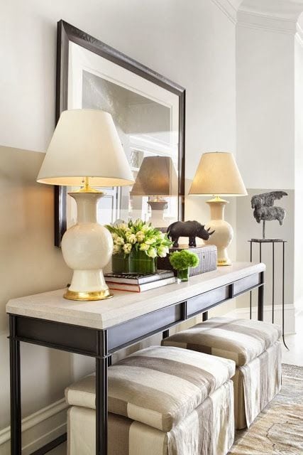 2 lamps on console table