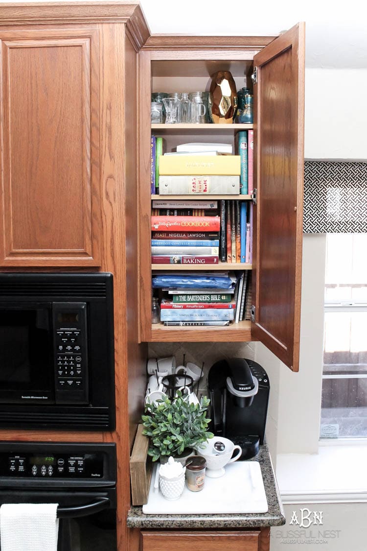 This is such a great idea! Transform a dead cabinet space with these coffee cabinet organization ideas! See more on https://ablissfulnest.com/ #coffee #coffeestation