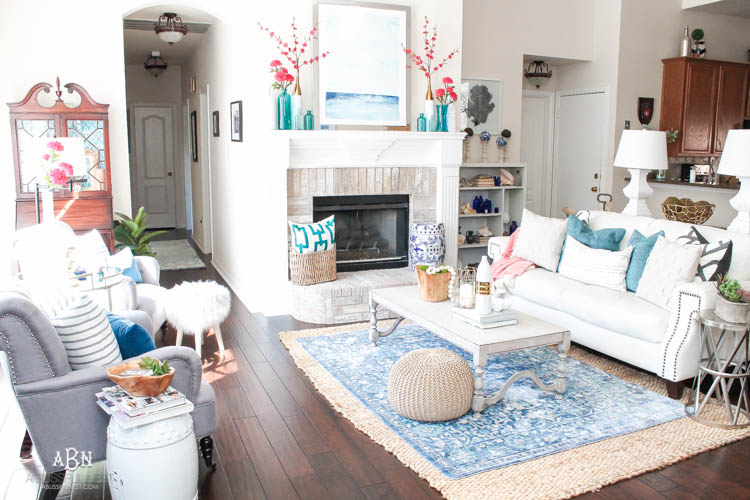 It's time to redecorate for spring! Love this fresh and inviting spring living room! See more on https://ablissfulnest.com/ #springdecorating #livingroom