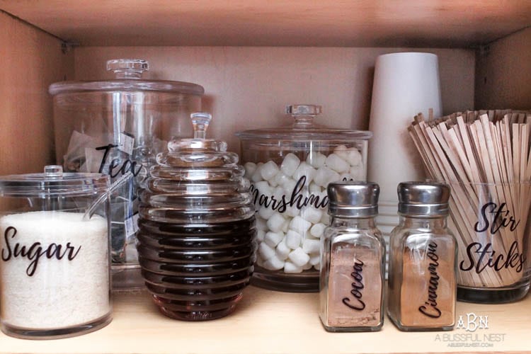 This is such a great idea! Transform a dead cabinet space with these coffee cabinet organization ideas! See more on https://ablissfulnest.com/ #coffee #coffeestation
