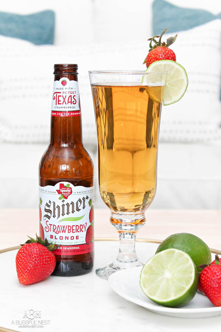 This is such a delicious beer cocktail recipe! Love the mix of strawberries and lime. See more on https://ablissfulnest.com/ #ad #totalwine #cocktailrecipe