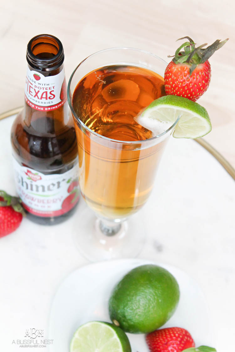 This is such a delicious beer cocktail recipe! Love the mix of strawberries and lime. See more on https://ablissfulnest.com/ #ad #totalwine #cocktailrecipe