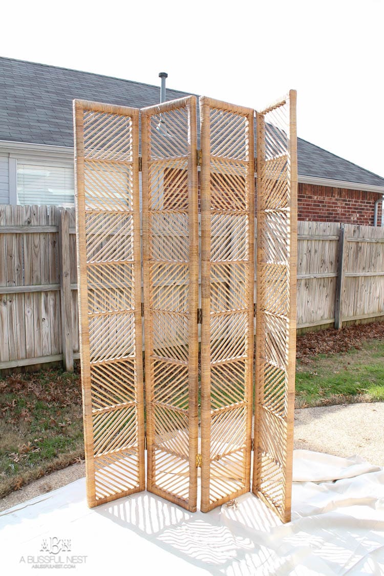 This thrifted rattan folding screen got a modern makeover with a gorgeous glossy navy Behr paint! What an incredible transformation! See more on https://ablissfulnest.com/ #behr #ad #rattanscreen #diytutorial #furnituremakeover