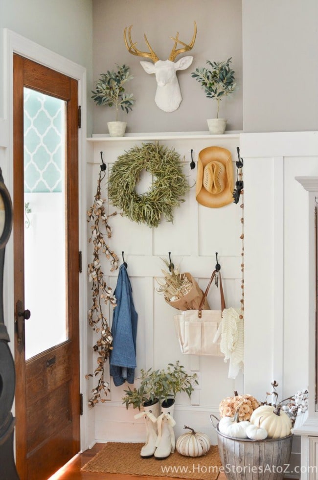 Adore this fall entryway by Home Stories from A to Z. Grab the best fall entryway ideas on https:ablissfulnest.com/ #falldecor #falldecorating #fallentrydecor