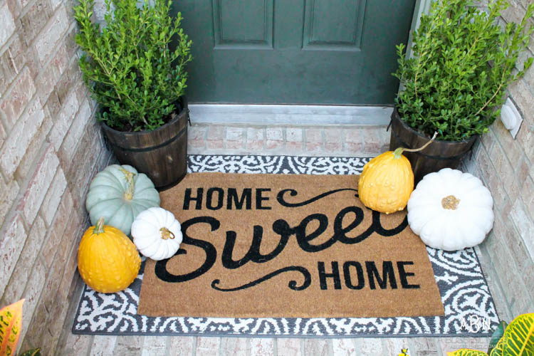 Classic colors with a pop of pattern make this gorgeous fall front porch! #fallfrontporch #falldecorideas