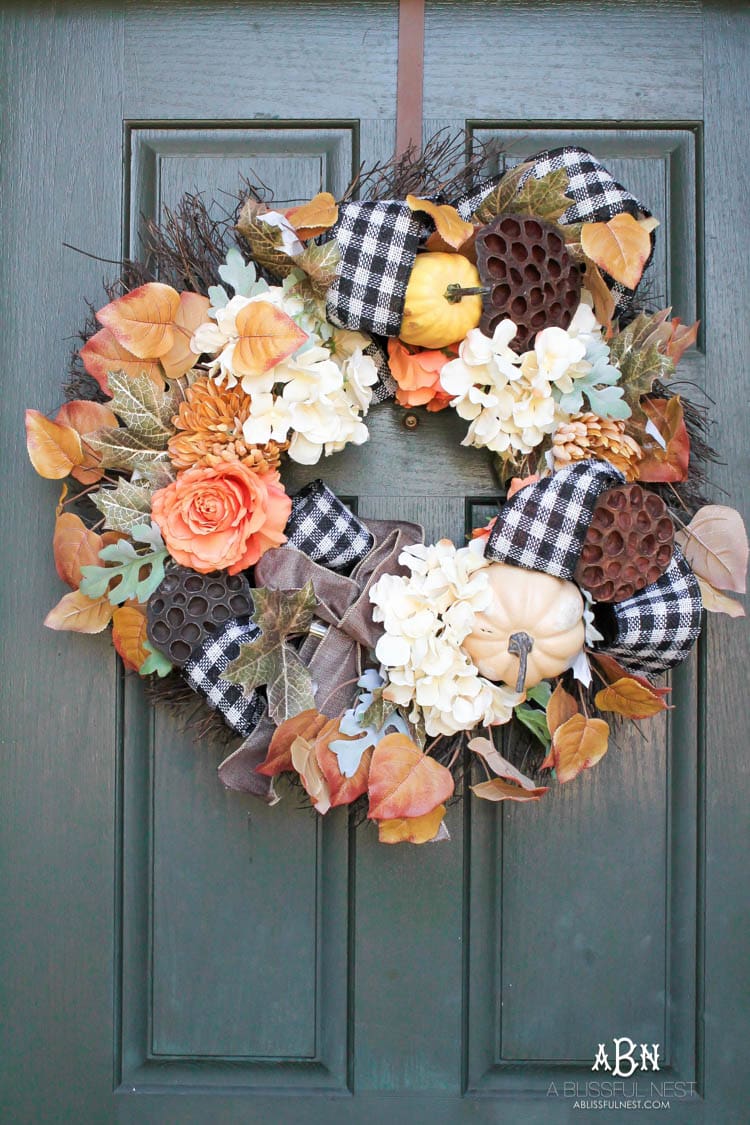 Classic colors with a pop of pattern make this gorgeous fall front porch! #fallfrontporch #falldecorideas