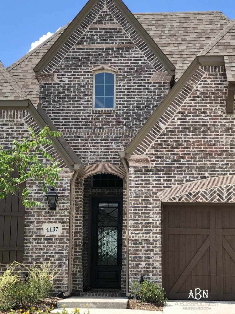 This is a beautiful brick exterior. If I was trying to figure out how to choose brick for your home, I'd start here! Love these brick selections for this exterior brick home being built. #exterior #homeexterior #homebuild