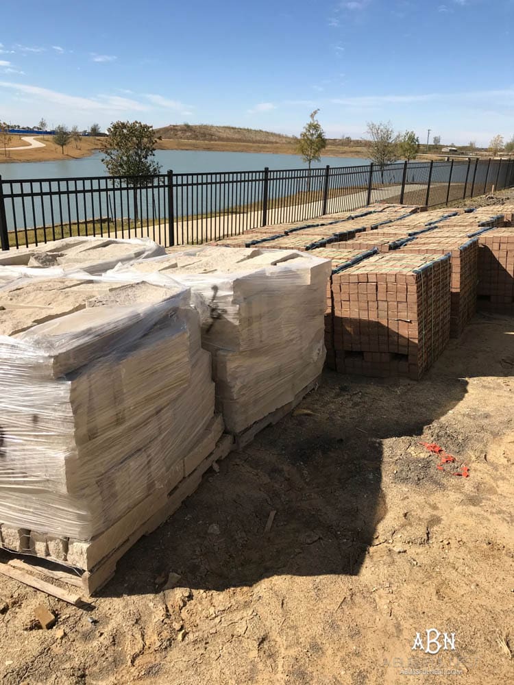 All these pallets of brick and stone for the exterior of our new home were delivered to our backyard! Excited to get started! Want to know how to choose brick for your home? Take it one step at a time with this helpful guide.