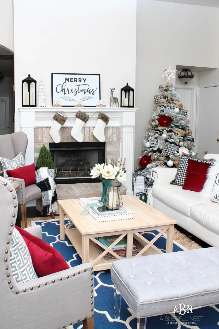 Love the black and white touches with red in this gorgeous Christmas Home Tour! See more on https://ablissfulnest.com/ #ad #kirklands #christmasdecor #christmashometour #christmasdecorating #christmastree #christmasentry 
