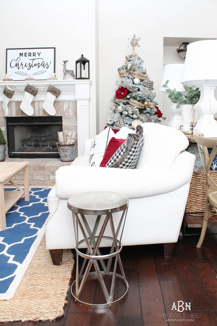 Love the black and white touches with red in this gorgeous Christmas Home Tour! See more on https://ablissfulnest.com/ #ad #kirklands #christmasdecor #christmashometour #christmasdecorating #christmastree #christmasentry