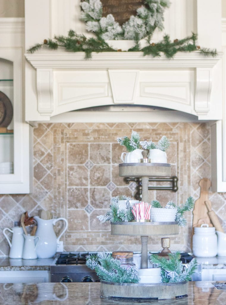 A Fully Stocked Hot Cocoa Station that can stay out on display all season long. See how to use a tiered tray to create a hot cocoa station that is perfect for entertaining. #hotcocoabar #hotcocoastation #tieredtray #winterweddingideas