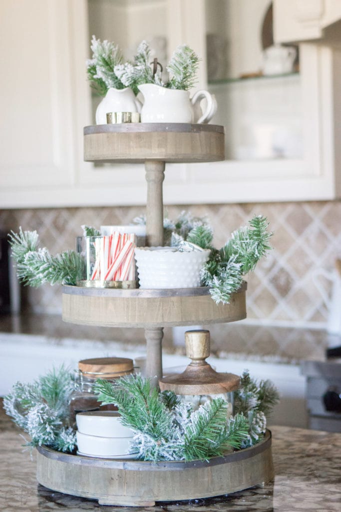 A Fully Stocked Hot Cocoa Station that can stay out on display all season long. See how to use a tiered tray to create a hot cocoa station that is perfect for entertaining. #hotcocoabar #hotcocoastation #tieredtray #winterweddingideas