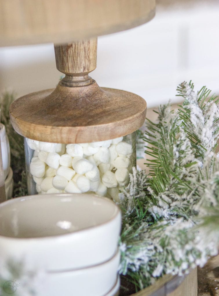 A Fully Stocked Hot Cocoa Station that can stay out on display all season long. See how to use a tiered tray to create a hot cocoa station that is perfect for entertaining. #hotcocoabar #hotcocoastation #tieredtray #winterweddingideas