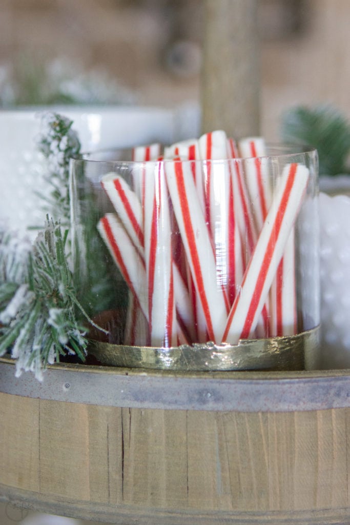 A Fully Stocked Hot Cocoa Station that can stay out on display all season long. See how to use a tiered tray to create a hot cocoa station that is perfect for entertaining. #hotcocoabar #hotcocoastation #tieredtray #winterweddingideas