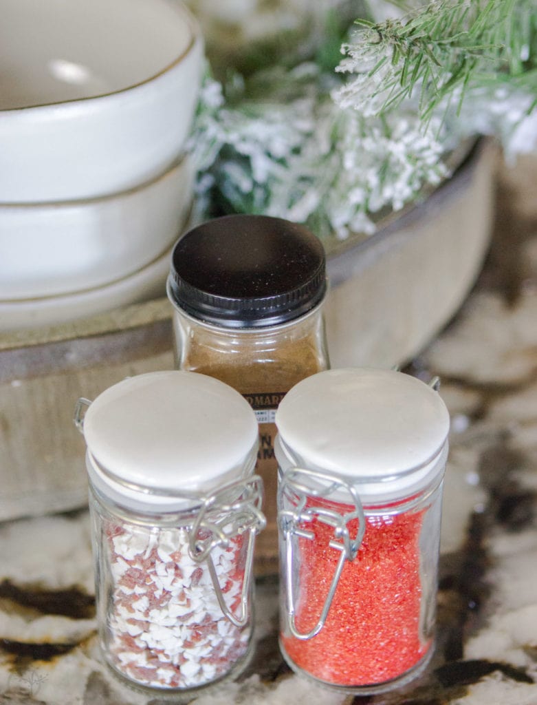 A Fully Stocked Hot Cocoa Station that can stay out on display all season long. See how to use a tiered tray to create a hot cocoa station that is perfect for entertaining. #hotcocoabar #hotcocoastation #tieredtray #winterweddingideas