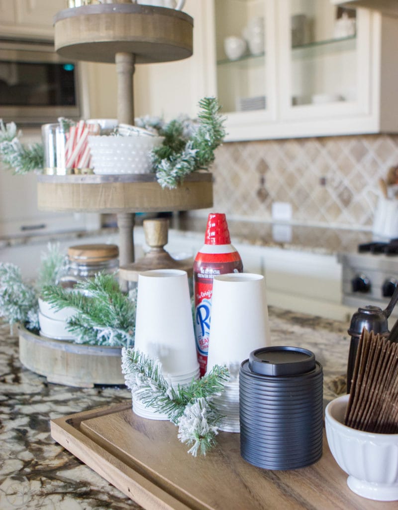 A Fully Stocked Hot Cocoa Station that can stay out on display all season long. See how to use a tiered tray to create a hot cocoa station that is perfect for entertaining. #hotcocoabar #hotcocoastation #tieredtray #winterweddingideas