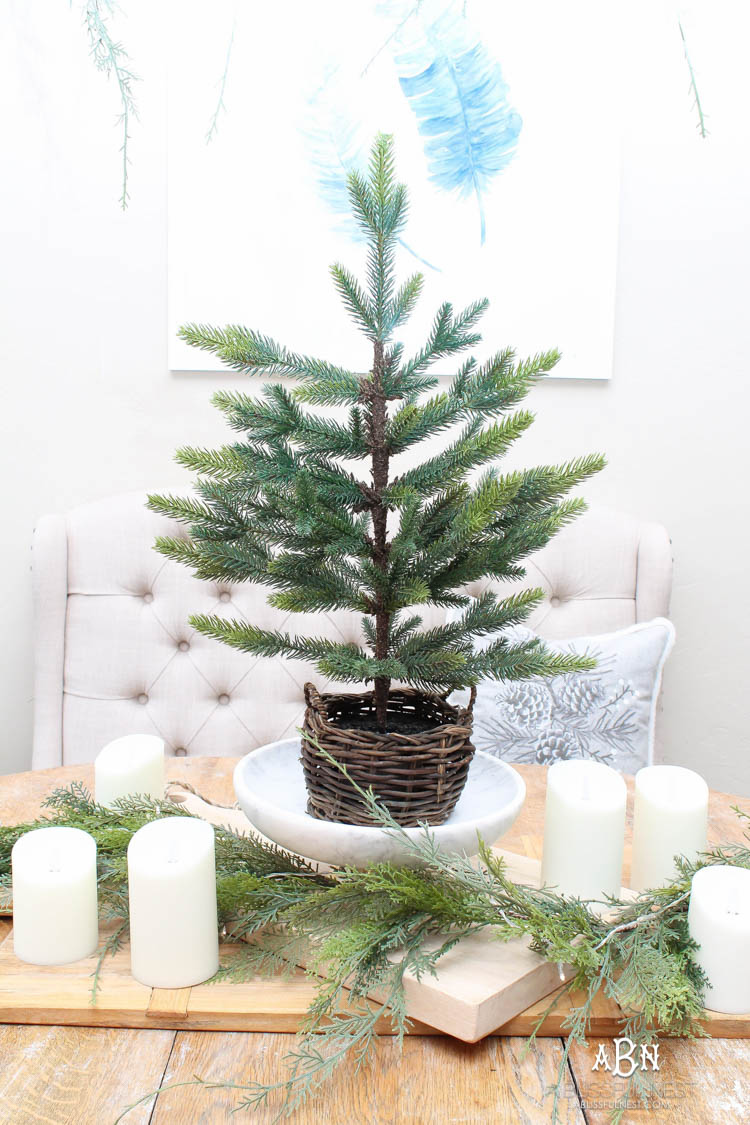 A classic christmas porch and beautiful neutral Christmas dining room idea. See more on https://ablissfulnest.com/ #christmasdecor #christmasideas #christmasfront porch #christmasdecoratingideas