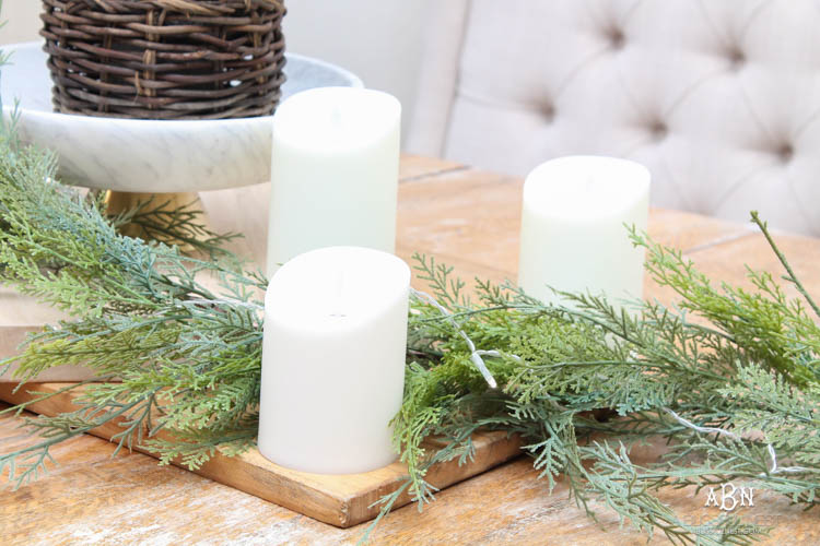 A classic christmas porch and beautiful neutral Christmas dining room idea. See more on https://ablissfulnest.com/ #christmasdecor #christmasideas #christmasfront porch #christmasdecoratingideas