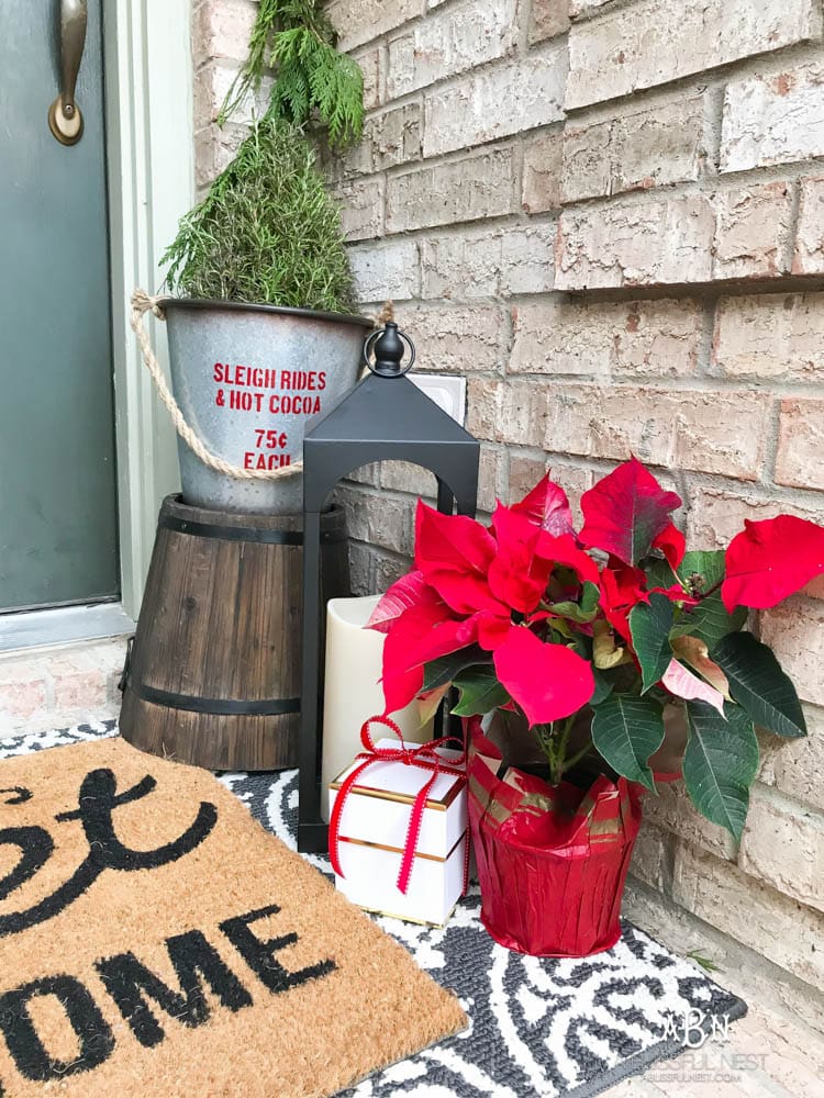 A classic christmas porch and beautiful neutral Christmas dining room idea. See more on https://ablissfulnest.com/ #christmasdecor #christmasideas #christmasfront porch #christmasdecoratingideas