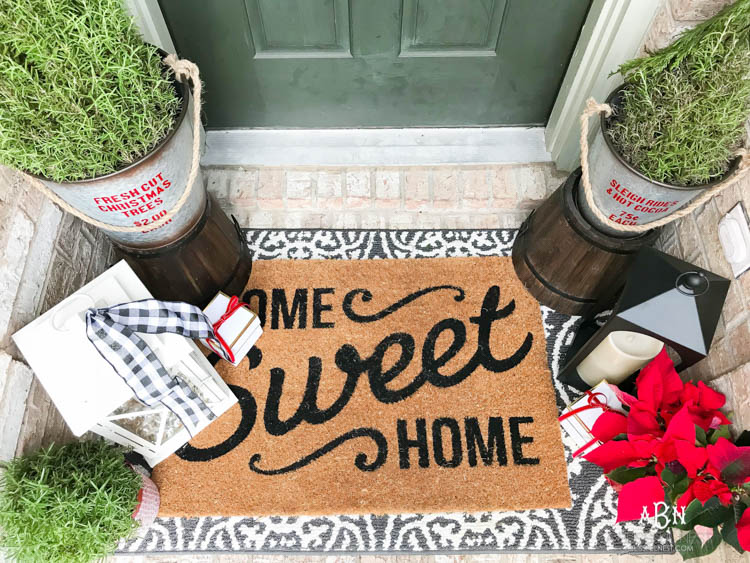 A classic christmas porch and beautiful neutral Christmas dining room idea. See more on https://ablissfulnest.com/ #christmasdecor #christmasideas #christmasfront porch #christmasdecoratingideas