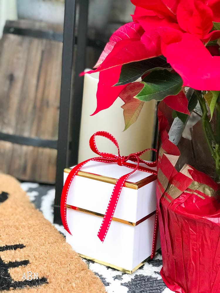 A classic christmas porch and beautiful neutral Christmas dining room idea. See more on https://ablissfulnest.com/ #christmasdecor #christmasideas #christmasfront porch #christmasdecoratingideas