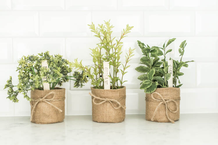  Love these cute faux herb baskets for the kitchen! #ad #AthomeStores #springdecorating #springdecoratingideas #kitchen #springkitchen #whitekitchen