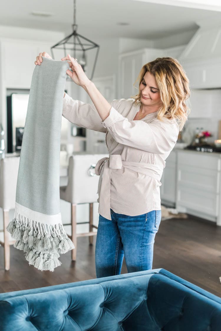 Add lightweight throw blankets for spring. #ad #AthomeStores #springdecorating #springdecoratingideas #coastallivingroom