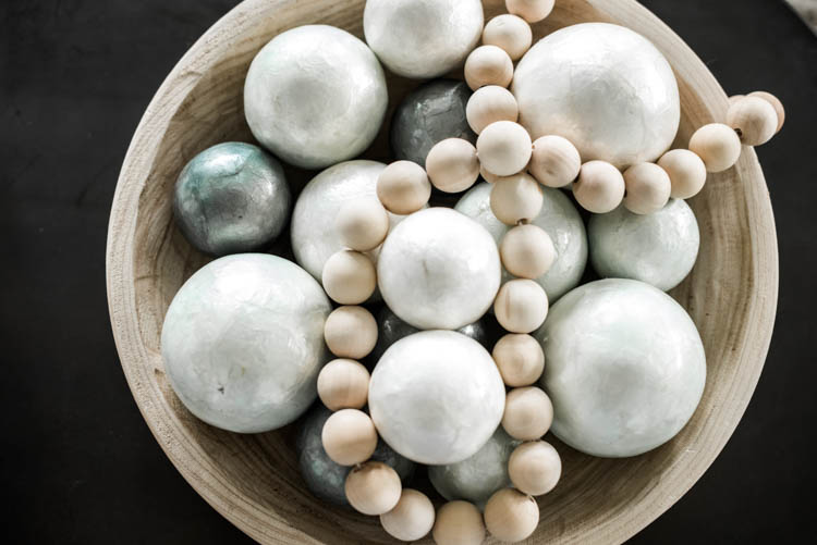 Gorgeous mint and white capez shell balls make such a statement. #ad #AthomeStores #springdecorating #springdecoratingideas #coastallivingroom