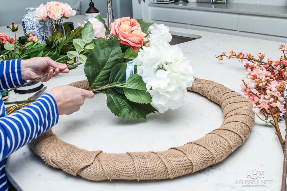 Easy steps to make this gorgeous peony flower wreath. #springwreath #diytutorial #flowerwreath #wreathtutorial