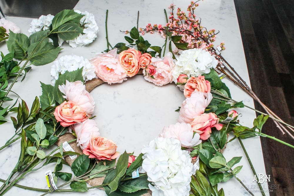 Easy steps to make this gorgeous peony flower wreath. #springwreath #diytutorial #flowerwreath #wreathtutorial