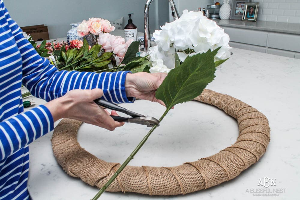 Easy steps to make this gorgeous peony flower wreath. #springwreath #diytutorial #flowerwreath #wreathtutorial