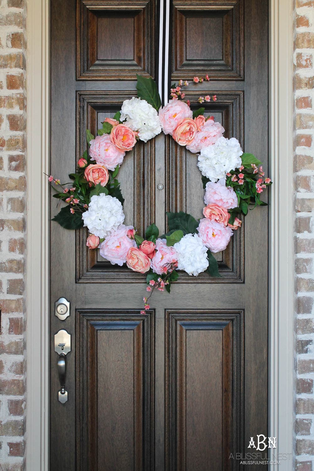 Easy steps to make this gorgeous peony flower wreath. #springwreath #diytutorial #flowerwreath #wreathtutorial