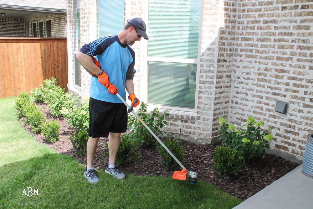 A small backyard makeover before and after with ideas on small backyard landscaping ideas. #ad #husqvarna #backyardideas #brickhouse #landscaping