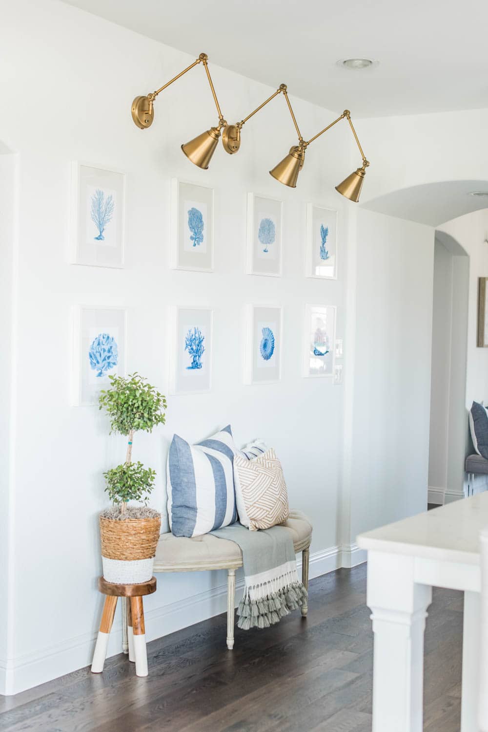 Beautiful summer accents in this all white kitchen. More white kitchen ideas on https://ablissfulnest.com #ABlissfulNest #whitekitchen #kitcheninspiration #kitchenideas