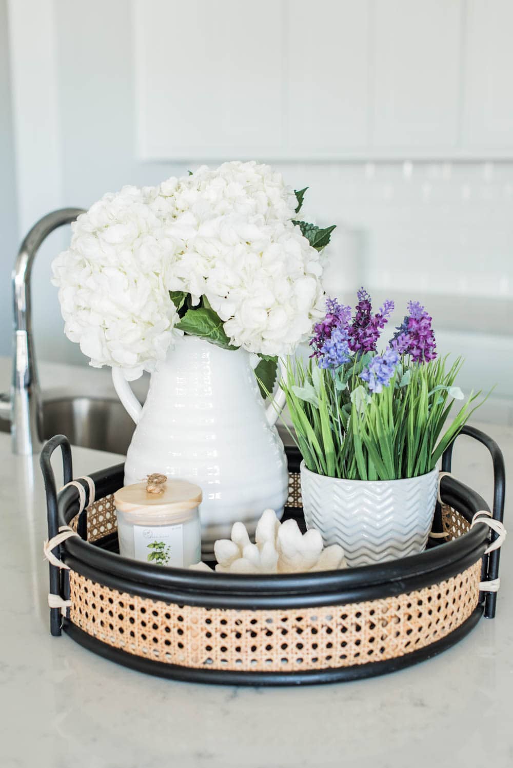 Beautiful summer accents in this all white kitchen. More white kitchen ideas on https://ablissfulnest.com #ABlissfulNest #whitekitchen #kitcheninspiration #kitchenideas