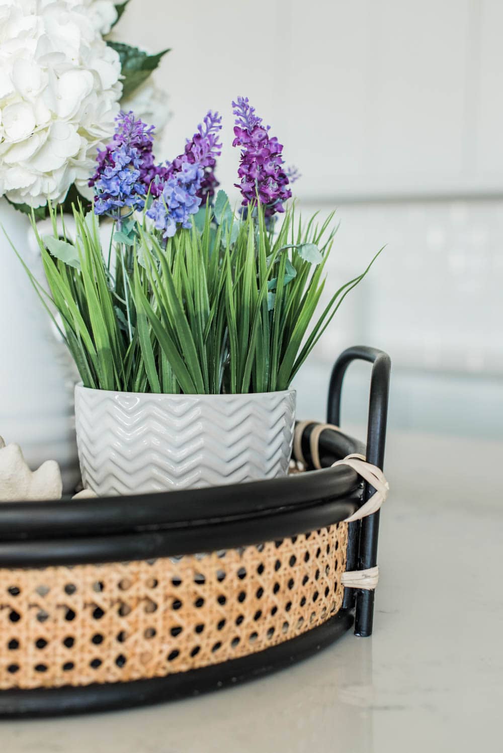 Beautiful summer accents in this all white kitchen. More white kitchen ideas on https://ablissfulnest.com #ABlissfulNest #whitekitchen #kitcheninspiration #kitchenideas