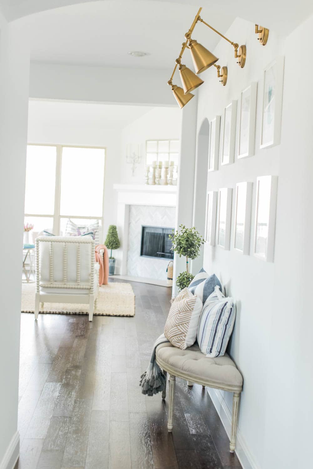 Beautiful summer accents in this all white kitchen. More white kitchen ideas on https://ablissfulnest.com #ABlissfulNest #whitekitchen #kitcheninspiration #kitchenideas