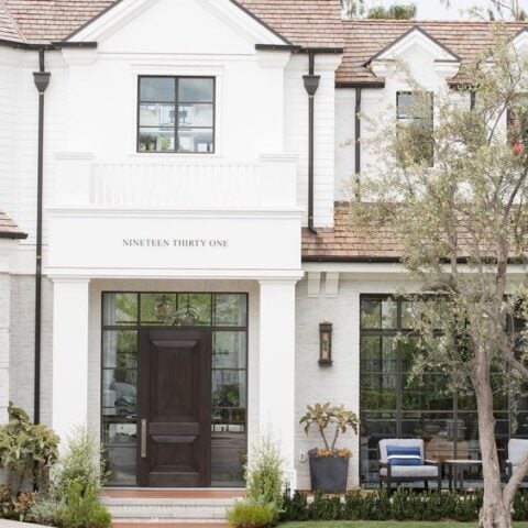 Just love the house number details on this all white exterior home.