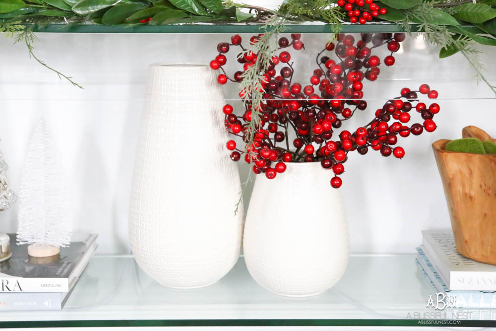 Pop holiday berries into your existing décor. Beautiful pop of color in this classic Christmas décor in this entryway. #christmasentryway #christmasentry #christmasentrydecor #christmasentrywayideas #christmashometour