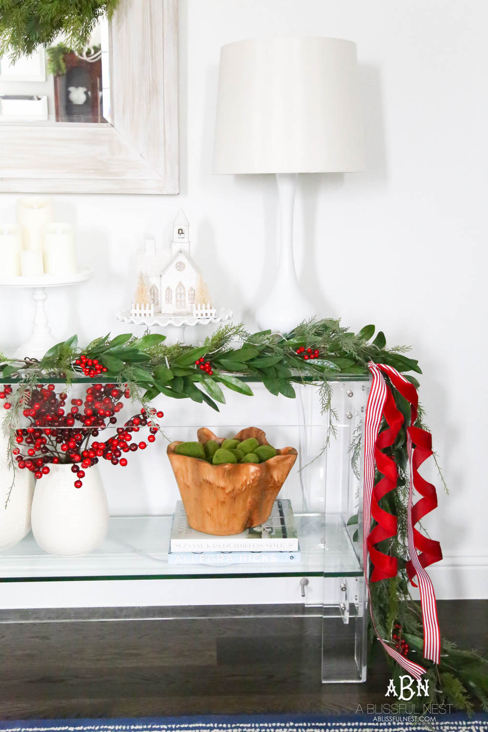 Pop holiday berries into your existing décor. Beautiful pop of color in this classic Christmas décor in this entryway. #christmasentryway #christmasentry #christmasentrydecor #christmasentrywayideas #christmashometour