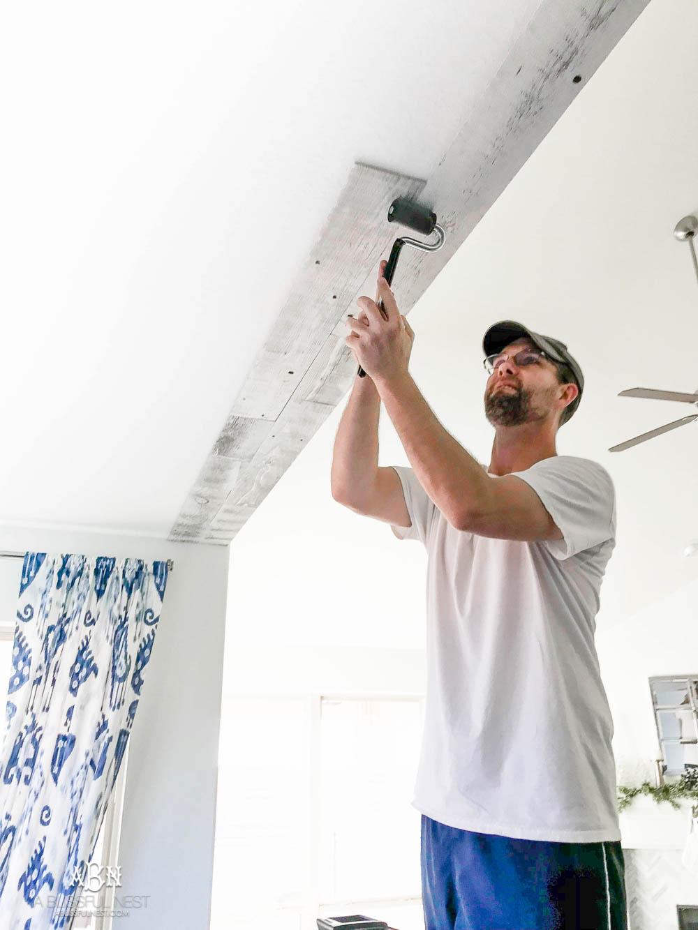 This is the simplest and easy way to install farmhouse barnwood on a ceiling! Just peel and stick these boards from Stikwood for a dramatic makeover to your plain ceiling or wall. More details on https://ablissfulnest.com #farmhousedecor #farmhouseproject #farmhousestyle #ad #stikwood