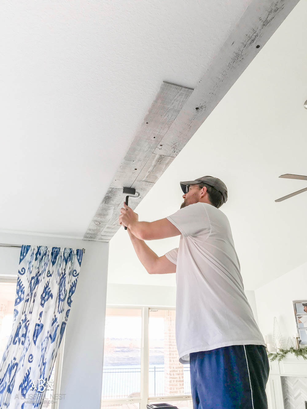 This is the simplest and easy way to install farmhouse barnwood on a ceiling! Just peel and stick these boards from Stikwood for a dramatic makeover to your plain ceiling or wall. More details on https://ablissfulnest.com #farmhousedecor #farmhouseproject #farmhousestyle #ad #stikwood