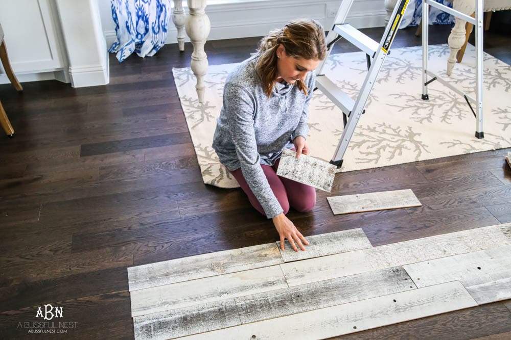 This is the simplest and easy way to install farmhouse barnwood on a ceiling! Just peel and stick these boards from Stikwood for a dramatic makeover to your plain ceiling or wall. More details on https://ablissfulnest.com #farmhousedecor #farmhouseproject #farmhousestyle #ad #stikwood