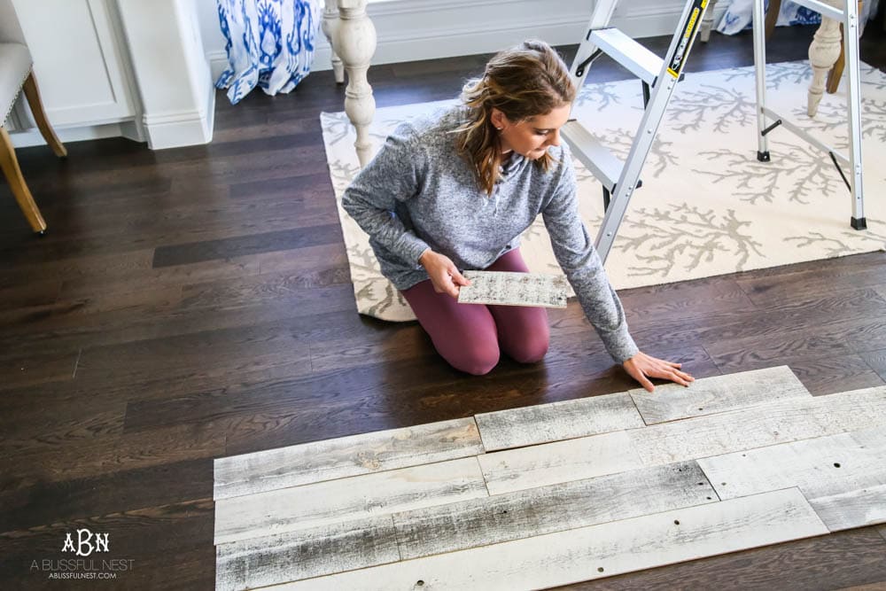 This is the simplest and easy way to install farmhouse barnwood on a ceiling! Just peel and stick these boards from Stikwood for a dramatic makeover to your plain ceiling or wall. More details on https://ablissfulnest.com #farmhousedecor #farmhouseproject #farmhousestyle #ad #stikwood