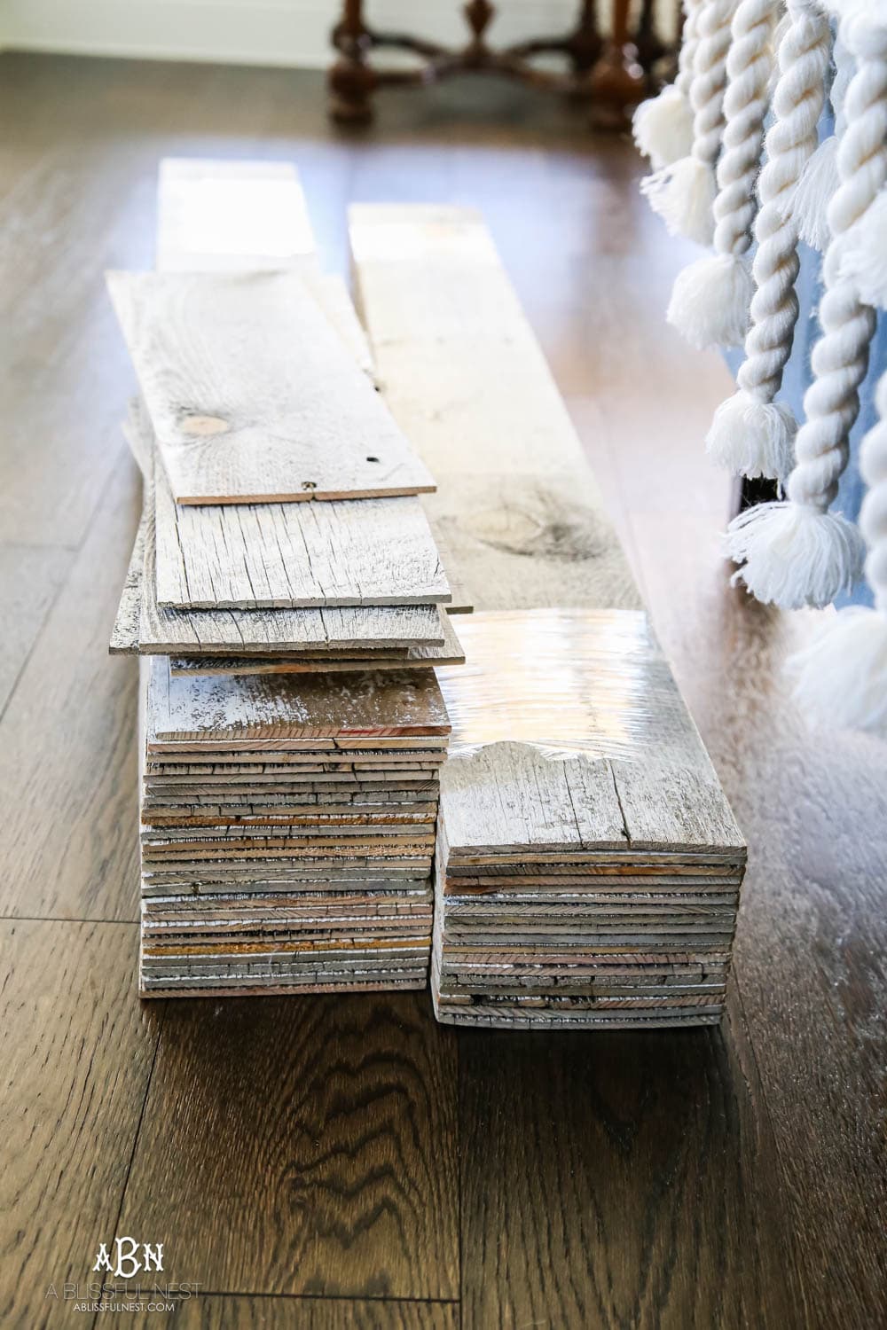 This is the simplest and easy way to install farmhouse barnwood on a ceiling! Just peel and stick these boards from Stikwood for a dramatic makeover to your plain ceiling or wall. More details on https://ablissfulnest.com #farmhousedecor #farmhouseproject #farmhousestyle #ad #stikwood