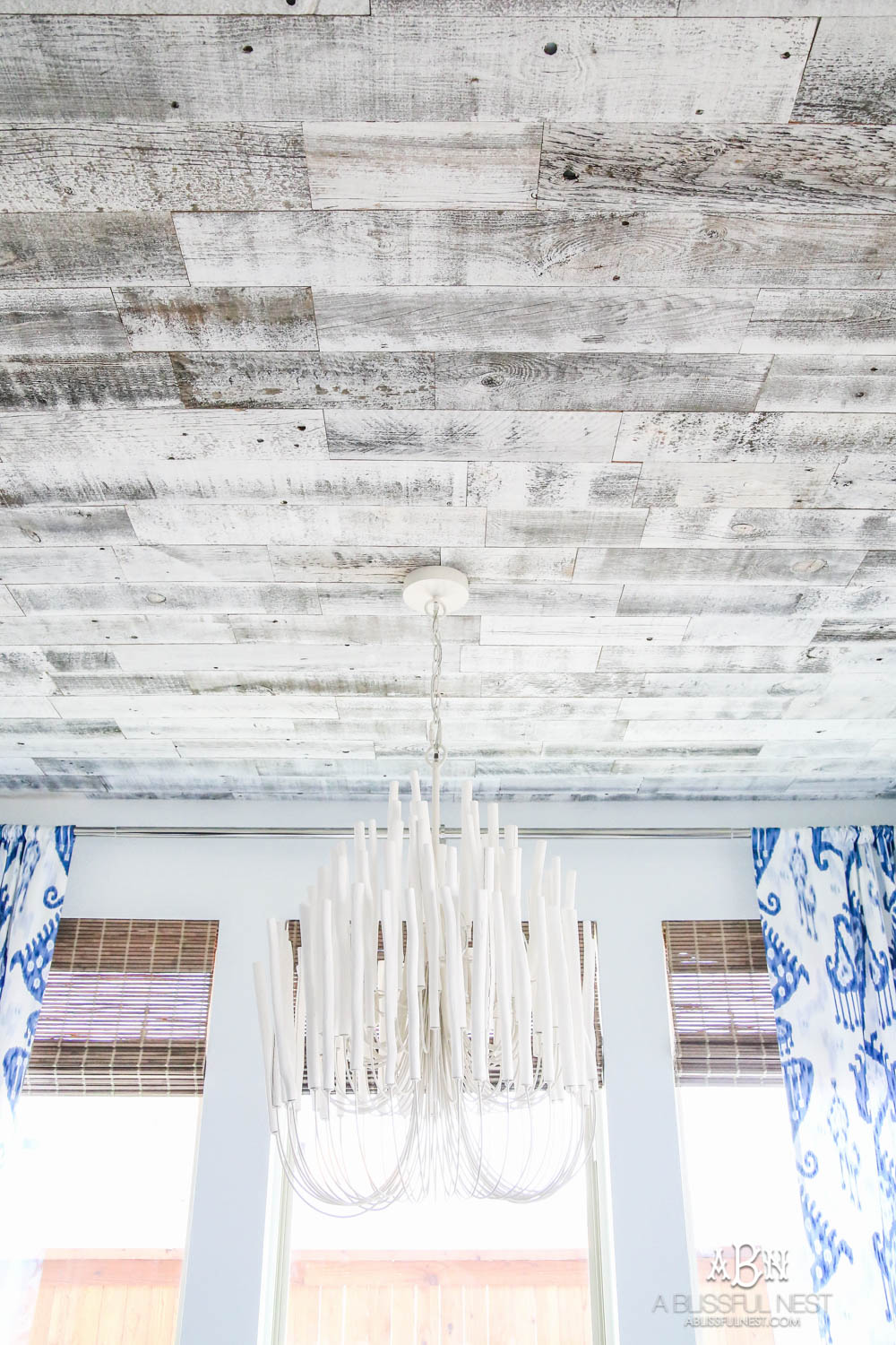 Blue and white breakfast room with coastal farmhouse style. All the sources + details in post! See more on https://ablissfulnest.com #ABlissfulNest #breakfastroom #designtips #diningroom 